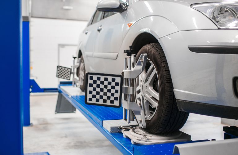 car on stand for wheel Alignment
